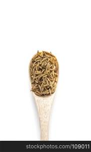 Pile of cumin seeds in wooden spoon isolated on white background. Pile of cumin seeds in wooden spoon isolated on white