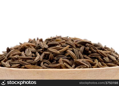 Pile of cumin seeds isolated on white background