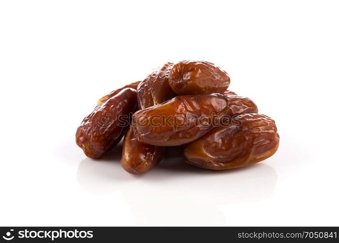 pile of dates fruits isolated on a white background