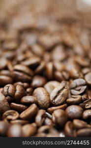 Pile of decaffinated coffee beans, short DOF focus on foreground.