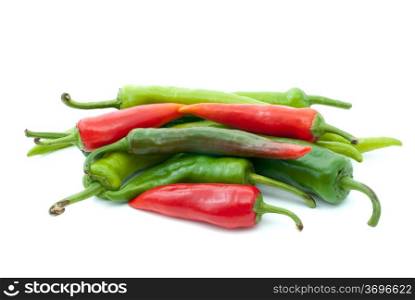 Pile of different hot peppers isolated on the white background