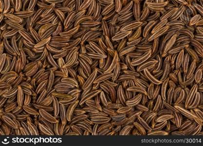 Pile of dry caraway seeds as a background