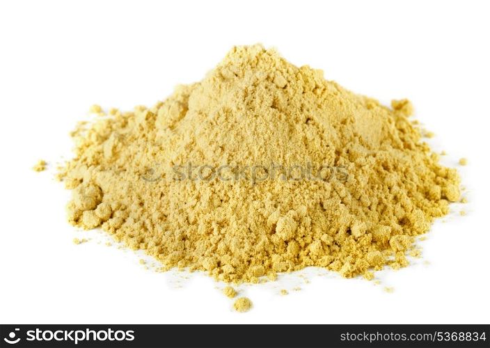 Pile of dry mustard powder spice isolated on white