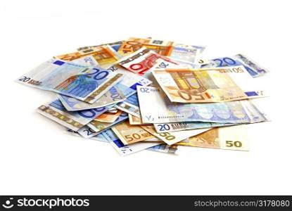 Pile of european currency bills isolated on white background