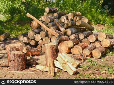 Pile of firewood and axe