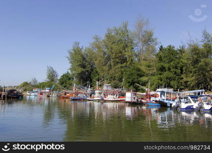 pile of fishing boat in canal with beautiful sky background