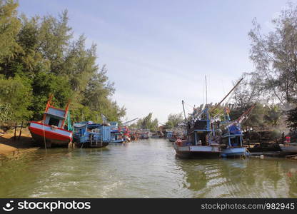 pile of fishing boat in canal with beautiful sky background