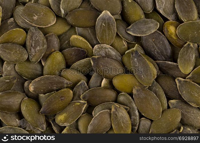 Pile of fresh dry pumpkin seeds close up