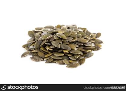Pile of fresh dry pumpkin seeds isolated on white background