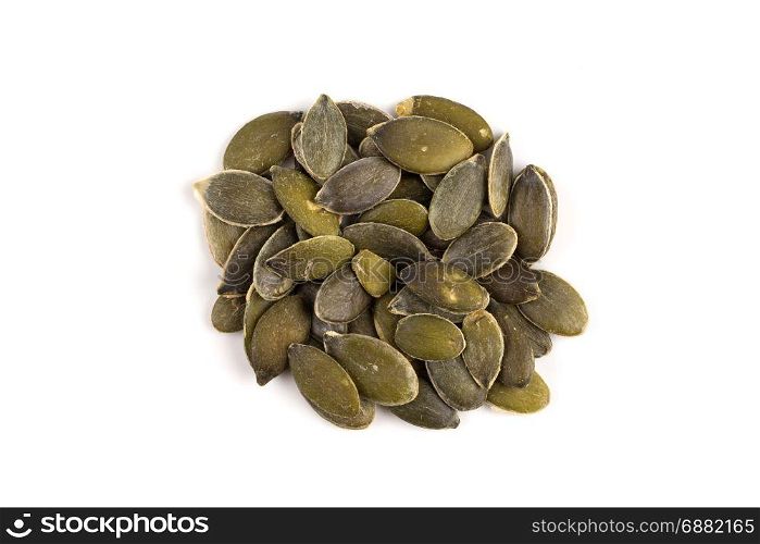 Pile of fresh dry pumpkin seeds isolated on white background