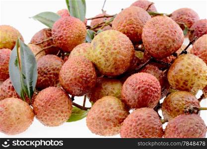 Pile of Fresh lychee fruits on a white background