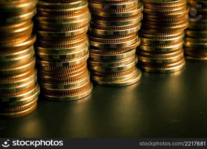 Pile of gold coins money stack in finance treasury deposit bank account saving . Concept of corporate business economy and financial growth by investment in valuable asset to gain cash revenue .. Pile of gold coins money stack in finance treasury deposit bank account saving