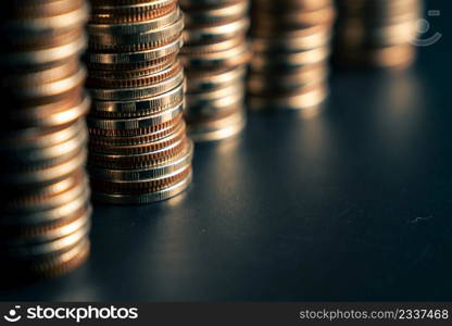 Pile of gold coins money stack in finance treasury deposit bank account saving . Concept of corporate business economy and financial growth by investment in valuable asset to gain cash revenue .. Pile of gold coins money stack in finance treasury deposit bank account saving