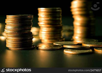 Pile of gold coins stack in finance treasury deposit bank account for saving . Concept of corporate business economy and financial growth by investment in valuable asset to gain cash revenue profit .. Pile of gold coins stack in finance treasury deposit bank account for saving