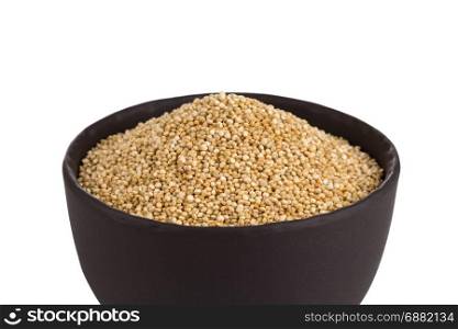 Pile of grain quinoa seeds in bowl isolated over the white background