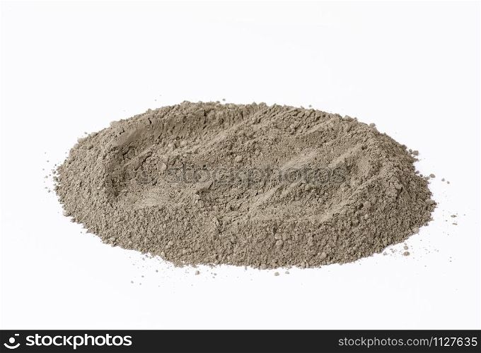 pile of gray dry Crimean fine clay on a white background, treatment for face and body