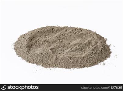 pile of gray dry Crimean fine clay on a white background, treatment for face and body