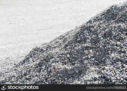 Pile of gray gravel rocks sloping diagonally.