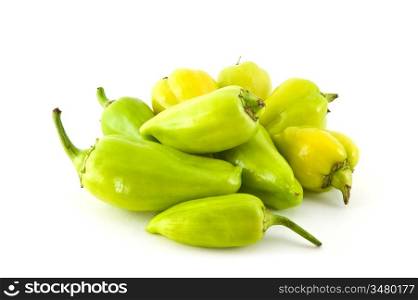 pile of green peppers isolated on a white background
