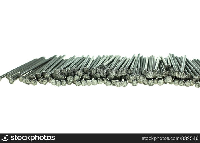 Pile of iron nails at white background