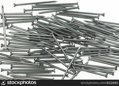 Pile of iron nails at white background