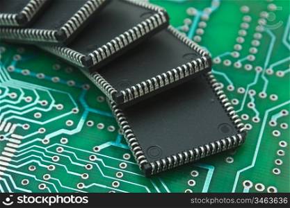 pile of microchips on a printed circuit board
