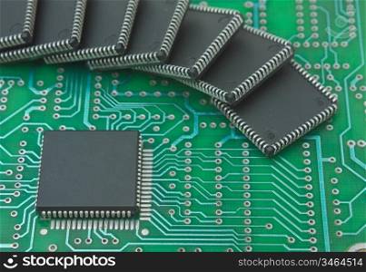 pile of microchips on a printed circuit board