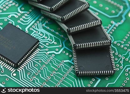 pile of microchips on a printed circuit board