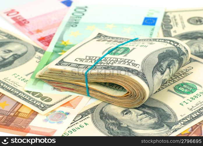 Pile of money- cash of US dollars and euros for business background