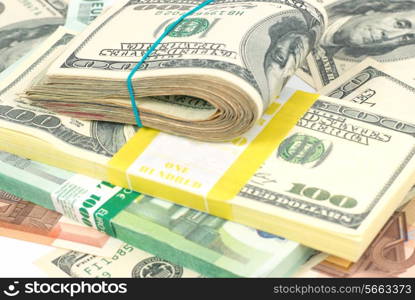 Pile of money- cash of US dollars and euros for business background