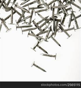 Pile of nails against white background.
