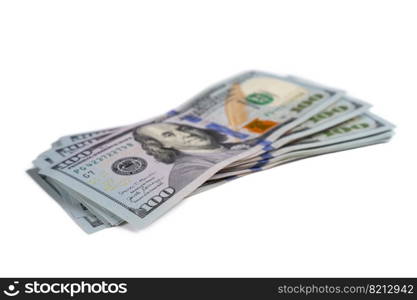 Pile of new design US dollar bills isolated on white background. Hundreds of dollar cash banknotes. Top view, flat lay. Business, finance, bank, currency, economy, wealth concept