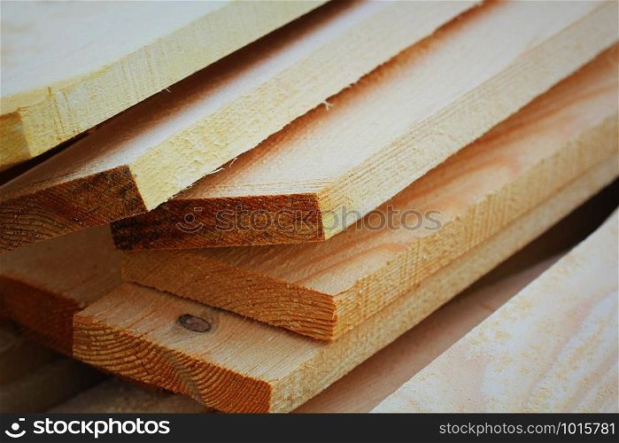 Pile of new wooden boards at construction site .. Pile of new wooden boards at construction site