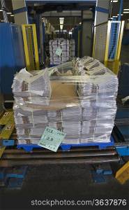 Pile of newspapers in factory