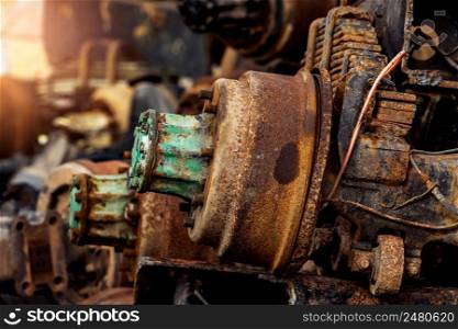 Pile of old rusty truck axle at second hand market shop. Used automotive part for sale. Old rear differential of truck. Truck rear axle. Heavy duty truck rear axle. Used auto spare parts for reuse.