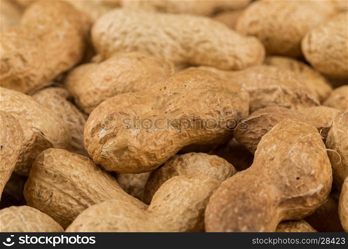 Pile of peanuts shells close up for background