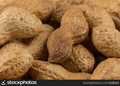 Pile of peanuts shells close up for background