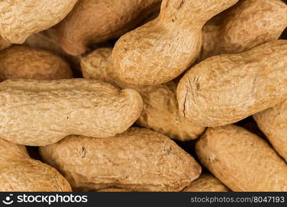 Pile of peanuts shells close up for background