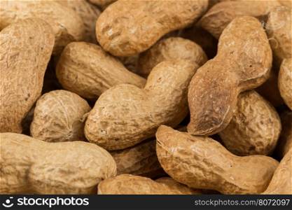 Pile of peanuts shells close up for background