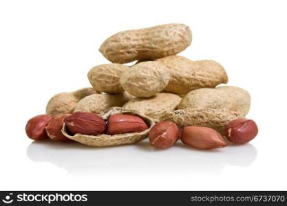 pile of peanuts with reflection on white background