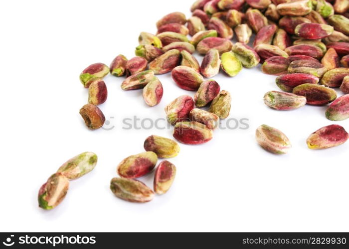Pile of pistachios isolated on white background.