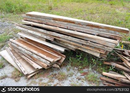 Pile of recycled used woods at the construction project