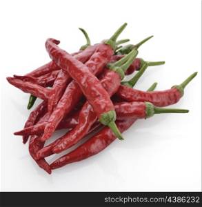 Pile Of Red Chili Peppers On White Background.