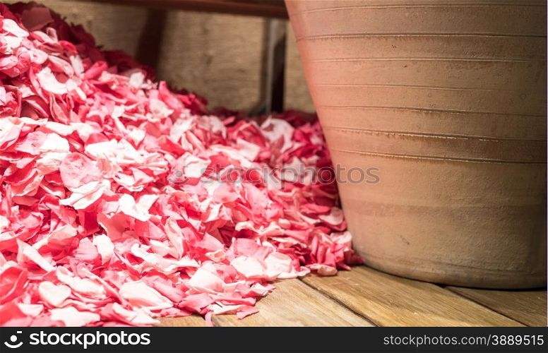 Pile of Rose Petals next to Large Clay Pot