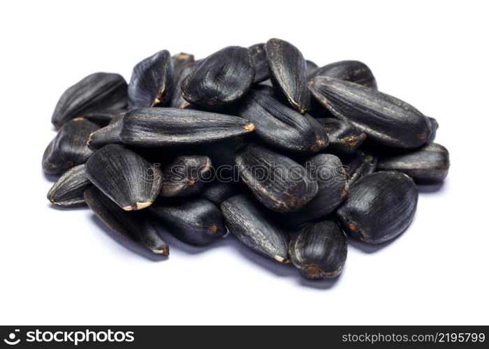 pile of seeds of a sunflower isolated on a white background, a subject products. pile of seeds of a sunflower isolated on a white background