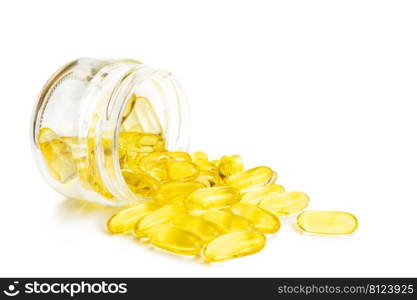 Pile of softgels capsules Omega 3 in bottle isolated on white background. Close up with copy space. Pile of capsules Omega 3 isolated on white background