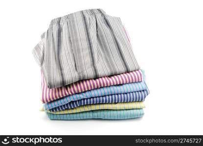 pile of stripped boxer shorts (male underwear) isolated on white background