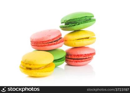 pile of Tasty colorful macaroons on white background