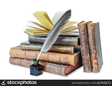 Pile of the old books and a quill in the inkwell on a white background