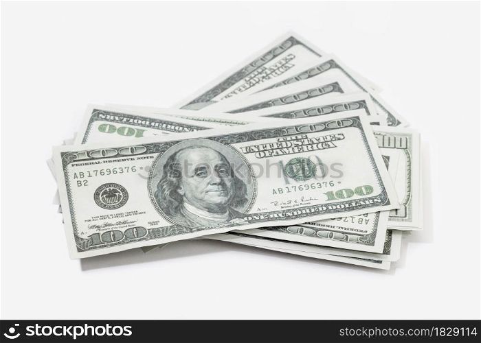 Pile of US dollar bills isolated on white background. US banknotes